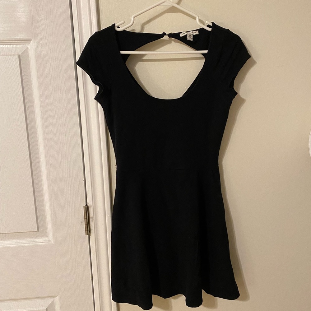 Black short sleeve mini dress with open back detail